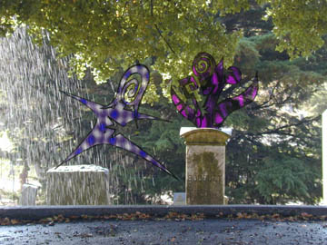 Ghost reaching for a grave bouquet while escaping the rain